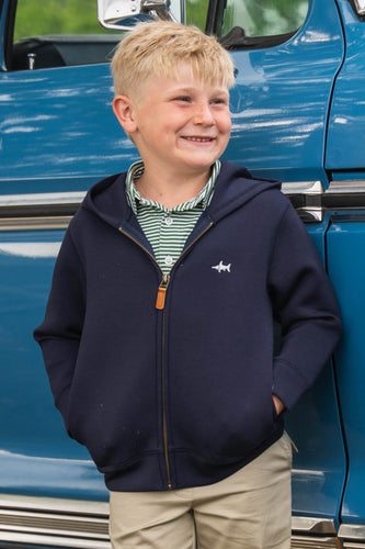 The Navy Hampton Hoodie by Saltwater Boys offers a stylish and comfortable layer for active boys. Crafted with a cozy scuba fabric and featuring a distinctive leather pull front zipper, it’s the perfect choice for cooler fall days. This hoodie provides just the right amount of warmth without the bulk of a coat, making it ideal for boys who prefer a lightweight, trendy option to stay comfortable and cool. 
