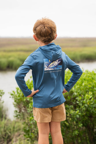 Keep your little adventurer cool and protected with the Boy's Tuna Performance Hoodie from Saltwater Boys. Crafted from breathable, performance fabric with UPF 50+ protection, this blue hoodie shields young skin from harmful sun rays during outdoor play. The striking tuna fish graphic on the back adds a splash of style, while the classic SWB logo on the front offers a timeless look. Perfect for toddlers to tweens, this hoodie combines comfort, sun safety, and standout design in one versatile piece.