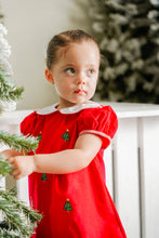 Load image into Gallery viewer, Celebrate the season in style with the Girls Christmas Tree Kendall Dress from Zuccini Kids. This charming red corduroy dress is adorned with festive Christmas Tree embroidery and accented with classic red and white gingham details. Featuring a delicate Peter Pan collar and scalloped hem, it’s the perfect holiday outfit for your little one to shine and coordinate beautifully with sibling looks. Embrace timeless holiday cheer and create lasting memories in this delightful dress.
