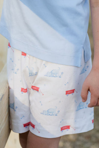 These Puppy Tails Knit Conrad Shorts from James & Lottie showcase an irresistible puppy and wagon design in patriotic red, white, and blue. Perfect for your little one's summer wardrobe, these shorts create an adorable ensemble when paired with the Light Blue Knit Wagon Polo. Complete the family look with the matching Reed Jon Jon available in infant sizes 12m-24m. Your little one will look picture-perfect while staying comfortable all day long.