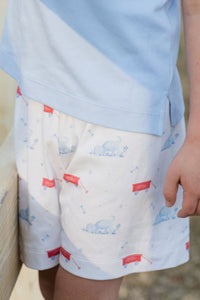 These Puppy Tails Knit Conrad Shorts from James &amp; Lottie showcase an irresistible puppy and wagon design in patriotic red, white, and blue. Perfect for your little one's summer wardrobe, these shorts create an adorable ensemble when paired with the Light Blue Knit Wagon Polo. Complete the family look with the matching Reed Jon Jon available in infant sizes 12m-24m. Your little one will look picture-perfect while staying comfortable all day long.