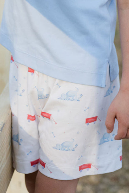 These Puppy Tails Knit Conrad Shorts from James & Lottie showcase an irresistible puppy and wagon design in patriotic red, white, and blue. Perfect for your little one's summer wardrobe, these shorts create an adorable ensemble when paired with the Light Blue Knit Wagon Polo. Complete the family look with the matching Reed Jon Jon available in infant sizes 12m-24m. Your little one will look picture-perfect while staying comfortable all day long.