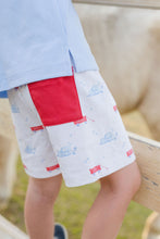Load image into Gallery viewer, These Puppy Tails Knit Conrad Shorts from James &amp; Lottie showcase an irresistible puppy and wagon design in patriotic red, white, and blue. Perfect for your little one&#39;s summer wardrobe, these shorts create an adorable ensemble when paired with the Light Blue Knit Wagon Polo. Complete the family look with the matching Reed Jon Jon available in infant sizes 12m-24m. Your little one will look picture-perfect while staying comfortable all day long.
