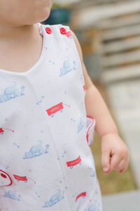 This charming Infant Boy's Puppy Dog Tails Reed Jon Jon from James &amp; Lottie features an irresistible blue, white, and red puppy and wagon print that will captivate everyone's attention. Crafted from comfortable knit fabric, this adorable outfit is perfect for your little puppy enthusiast. Make summer memories even more special with this eye-catching Jon Jon that combines playful style with classic appeal. A must-have addition to your little one's wardrobe!
