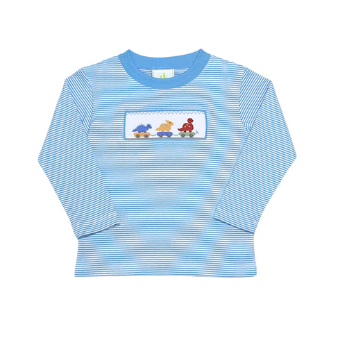 The Boys Dino Festival Harry's Play Tee from Zuccini Kids combines playful style with unbeatable comfort. Crafted from soft blue and white striped cotton, it features charming smocked detailing with embroidered dinosaurs on parade—perfect for any young dino enthusiast. This tee pairs effortlessly with the Leo Pants for a coordinated outfit and matches the Longall for little brothers, making it easy to create adorable sibling looks. 