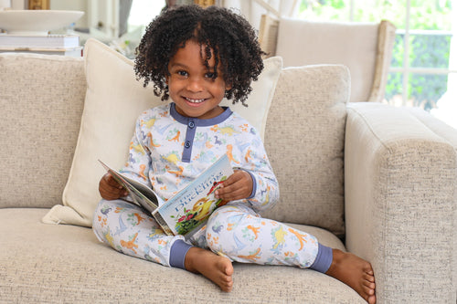 The Dino Adventures Lounge Set from Trotter Street is perfect for boys who love dinosaurs. Made from soft knit fabric, this cozy set keeps your little one comfortable whether he's winding down for bedtime or relaxing on a lazy afternoon. The playful dino print adds a fun touch that will make getting dressed an adventure every day.