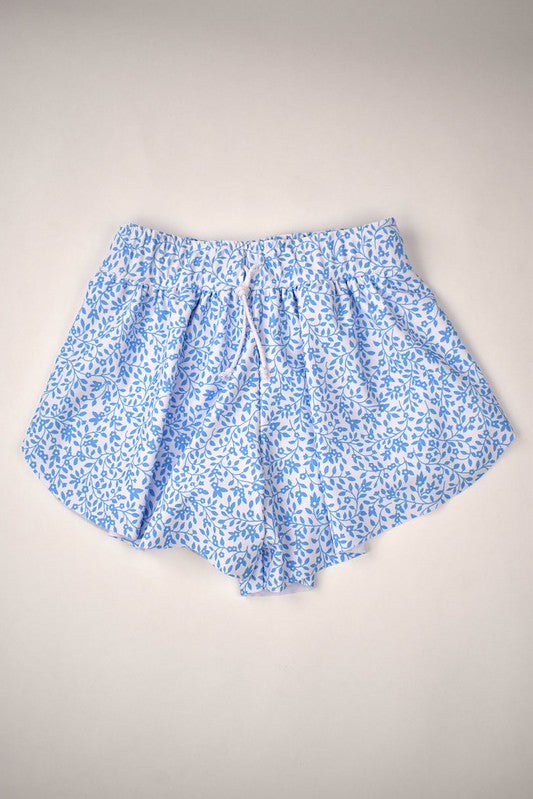 Bring a touch of whimsy to your little girl's wardrobe with the Girls Floral Butterfly Shorts by Funtasia Too! These adorable shorts feature a vibrant blue floral print! Perfect for playtime or special occasions, these shorts will have your girl feeling stylish and comfortable all day long!