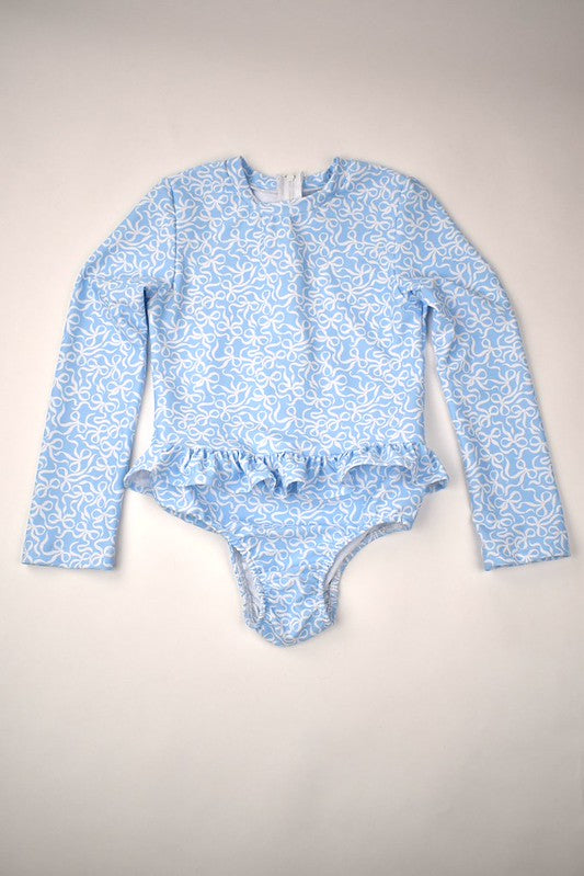 This adorable Infant Girls Ruffled Bow Rash Guard Swimsuit by Funtasia Too! is a must-have for any fashionable little girl! The blue bows and long sleeve design add a touch of elegance and flair, while the rash guard provides essential sun protection. Your little one will look and feel fabulous in this stylish swimsuit!