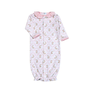 Introducing the Pink Bunnies Pima Converter from Baby Loren! Made from 100% pima cotton, this converter is not only perfect for the Easter season, but also for keeping your infant girl wrapped in love and cuteness. A must-have for any parent seeking comfort and style. Features ruffle neckline and buttons convert gown to a romper.