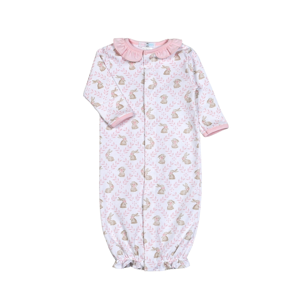Introducing the Pink Bunnies Pima Converter from Baby Loren! Made from 100% pima cotton, this converter is not only perfect for the Easter season, but also for keeping your infant girl wrapped in love and cuteness. A must-have for any parent seeking comfort and style. Features ruffle neckline and buttons convert gown to a romper.