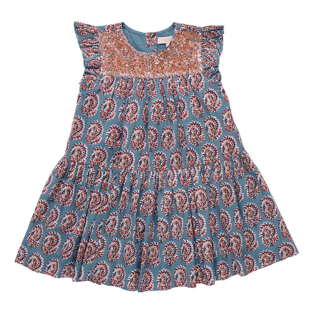 The Girls Fiona Dress in Blue Paisley Sparkle offers a captivating blend of vibrant paisley patterns and subtle sparkle, perfect for making your little girl stand out. Designed for comfort and style, this dress allows easy movement while adding a touch of magic to any occasion. Whether for celebrations or everyday adventures, it’s a charming choice that brings elegance and playful shine to her wardrobe.