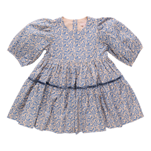 Load image into Gallery viewer, Girls Blue Floral Maribelle Dress from Pink Chicken. With three-quarter puffed sleeves and a full skirt that&#39;s tailor-made for twirling, this classic silhouette is accented with a navy velvet taping and a glitter button closure on back. This playful floral print will have her twirling all season!
