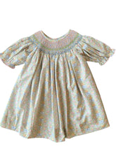 Load image into Gallery viewer, The Smocked Pumpkin Floral Analisa Bishop Dress from Shop Teeta combines charming fall florals with a delicate smocked neckline, creating an adorable look for infant girls. Its playful A-line silhouette allows for comfortable movement while showcasing a timeless design perfect for any autumn occasion. This piece offers both style and softness, making it a must-have for your little one’s wardrobe.
