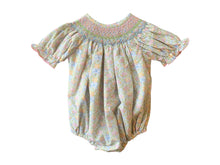 Load image into Gallery viewer, The Smocked Pumpkin Floral Analisa Bishop Bubble from Shop Teeta combines charming fall florals with a delicate smocked neckline, creating an adorable look for infant girls. Its playful bubble silhouette allows for comfortable movement while showcasing a timeless design perfect for any autumn occasion. This piece offers both style and softness, making it a must-have for your little one’s wardrobe.
