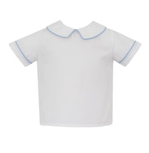Load image into Gallery viewer, Experience timeless style with our Boy&#39;s Woven Shirt with Blue Piping by Petit Bebe. This white knit shirt features a classic Peter Pan collar trimmed with elegant blue piping, adding a touch of sophistication to any outfit. Perfect for any occasion, this shirt will keep your little one looking stylish and polished!
