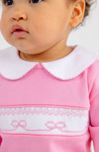 Load image into Gallery viewer, The Rigsby Romper in Hamptons Hot Pink by The Beaufort Bonnet Company brings vibrant charm to your little girl’s wardrobe. Its soft, classic design is enhanced by a delicate white Peter Pan collar with pink trim and sweet bow smocking, making every moment irresistibly adorable and joyful!
