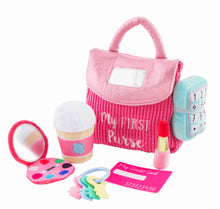 Load image into Gallery viewer, The life-like toys in Mud Pie’s My First Purse set will have your child pretending to be Mommy. The 7-piece set comes with a plush play purse. The purse comes with six familiar accessories: baby safe mirror, set of keys, make-up compact, credit card, plush lipstick, coffee cup with rattle and plush phone with ringing sound effect.
