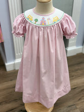 Load image into Gallery viewer, Step into the school year with charm in the Girls School House Bishop Dress by Petit Bebe. Its delicate pink check gingham and intricate school house smocking bring timeless elegance to the first day of school—making every moment feel special and unforgettable!
