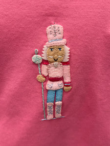Dress your little one in festive charm with the Girls Applique Nutcracker Ruffle Pant Set by Squiggles. Crafted from soft 100% pima cotton, this set combines comfort with playful style. The bright pink tunic features a delicate pastel Nutcracker applique and a flirty ruffle hem, perfectly complemented by coordinating mint and white striped pants.&nbsp;