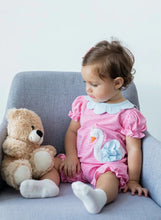 Load image into Gallery viewer, Dress your little one in pure charm with the Swan Petal Collar Bubble by Zuccini Kids! Soft pink and white stripes blend perfectly with a delicate blue collar and a sweet swan applique, creating an outfit that’s as adorable as her smile. Ready for endless hugs and twirls!

