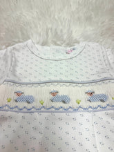 Load image into Gallery viewer, Dress your little one in the enchanting Blue Baby Lamb Smocked Bubble by Baby Loren. Crafted from soft Pima cotton and adorned with charming baby lamb smocking, this delightful outfit combines comfort and cuteness. Ideal as a precious gift for newborns, it promises to create cherished memories!

