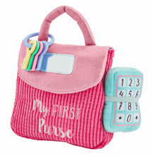 Load image into Gallery viewer, The life-like toys in Mud Pie’s My First Purse set will have your child pretending to be Mommy. The 7-piece set comes with a plush play purse. The purse comes with six familiar accessories: baby safe mirror, set of keys, make-up compact, credit card, plush lipstick, coffee cup with rattle and plush phone with ringing sound effect.
