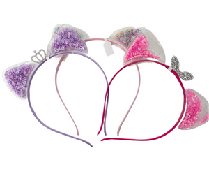 Add a whimsical touch to your little girl's accessories with Anuja Tolia's Embellished Ear Headbands! These playful headbands come in 3 colors and are sure to be a hit with your fashion-forward child.