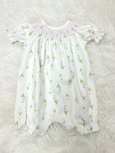 Load image into Gallery viewer, Dress your little princess in the Infant Girls Zoe Hand Smocked Bishop Bubble from Baby Loren. Crafted from soft Pima cotton, this charming bubble features delightful purple smocking and a sweet pink and purple tulip pattern. It's perfect for creating joyful memories while ensuring comfort and style!
