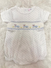 Load image into Gallery viewer, Dress your little one in the enchanting Blue Baby Lamb Smocked Bubble by Baby Loren. Crafted from soft Pima cotton and adorned with charming baby lamb smocking, this delightful outfit combines comfort and cuteness. Ideal as a precious gift for newborns, it promises to create cherished memories!
