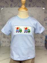 Load image into Gallery viewer, Dress your little boy in the School Trucks Smocked Tee—a charming blue striped knit tee bursting with playful school truck smocking. Soft, comfortable, and irresistibly adorable, it makes every school day feel special and full of adventure! Ready to inspire confidence and joy?

