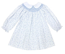 Load image into Gallery viewer, The Blue Blossom Billie Bishop Dress by Zuccini Kids delights with its charming blue floral print, timeless smocked neckline, and crisp white Peter Pan collar—crafted to make every moment picture-perfect for your little one. An exquisite choice for portraits and special occasions alike!
