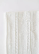 Load image into Gallery viewer, This charming Bailey Baby Blanket in Worth Avenue White by The Beaufort Bonnet Company is the baby essential that brings pure elegance to every snuggle session and looks absolutely stunning in any nursery! The luxuriously soft fabric wraps baby in cozy comfort while the crisp white shade and stitched crosses create that fresh, clean aesthetic that photographs like an absolute dream. It's the versatile must-have that works for anything from stroller rides to those precious milestone photos.
