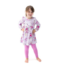 Load image into Gallery viewer, Wrap your little one in buttery-soft comfort with the Angel Dear Dahlia Floral Long Sleeve Ruffle Dress &amp; Legging Set, made entirely from silky-smooth viscose from bamboo. With gentle ruffle details and a twirly silhouette, this set is perfect for cooler days filled with cuddles, play, and picture-perfect moments.
