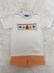 Celebrate fall in style with the Spooky Season Smocked Short Set from Cape Point Clothing. This charming outfit pairs a crisp white tee featuring a playful smocked "Spooky" design with coordinating orange and white gingham shorts. Perfect for your little one’s autumn adventures, this set combines comfort with festive flair, making it ideal for seasonal celebrations and everyday wear. Embrace the spirit of the season with a look that’s both cute and cozy.