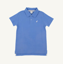 Load image into Gallery viewer, Elevate your summer wardrobe with the Prim and Proper Beach Polo in Sunrise Blvd Blue by The Beaufort Bonnet Company. This charming white and blue polo, featuring the iconic TBBC stork, is ideal for sunny adventures and effortlessly complements Sheffield shorts. Available for toddlers to tweens, it's a must-have for every stylish outing!
