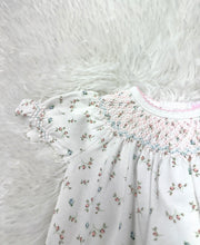 Load image into Gallery viewer, Introduce your little one to comfort and charm with the Bella Pink Floral Pima Hand Smocked Bubble by Baby Loren. Crafted from ultra-soft Pima cotton, this delightful bubble features a beautiful pink and blue floral pattern, adorned with hand smocking for an extra touch of elegance. It’s the perfect gift that combines style and comfort for your baby girl!

 
