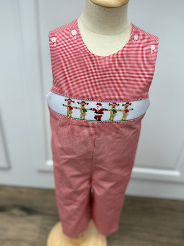 Get your little boy holiday-ready with the Boys Rockin' Reindeer Longall. Its red and white gingham fabric is accented by charming smocked reindeer and Santa embroidery, creating a festive and classic look. Designed for comfort and style, it’s perfect for holiday gatherings and pairs beautifully with matching sibling outfits to create memorable family moments.