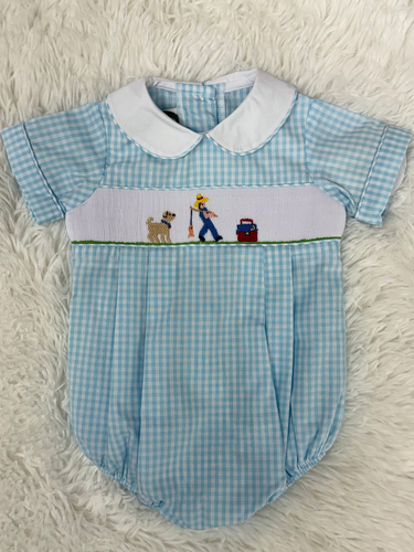 This Infant Boys Gone Fishing Bubble showcases a charming blue and white gingham pattern, highlighted by a detailed smocked fisherman & his best friend embroidery on the front. Designed for comfort and style, creating an adorable and polished outfit ideal for playful days and special occasions.