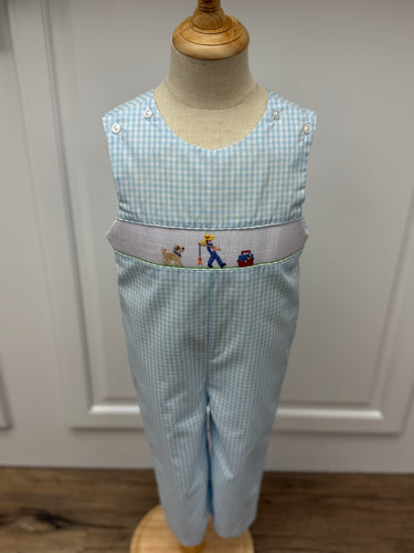 This Boys Gone Fishing Longall showcases a charming blue and white gingham pattern, highlighted by a detailed smocked fisherman & his best friend embroidery on the front. Designed for comfort and style, it pairs perfectly with a classic Peter Pan collar shirt, creating an adorable and polished outfit ideal for playful days and special occasions.