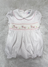 Load image into Gallery viewer, Dress your little one in the adorable Pink Baby Lamb Smocked Bubble by Baby Loren. Crafted from soft Pima cotton, this charming outfit features delightful pink dotted bubbles and a sweet smocked design with baby lambs, making it the perfect choice for your precious newborn girl. Embrace the cuteness!
