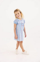 Load image into Gallery viewer, Celebrate new beginnings with the Holly Day Dress in First Day Flowers by The Beaufort Bonnet Company. Its charming floral pattern weaves in school details, while the classic silhouette and sweet Peter Pan collar make your little girl’s first day unforgettable—and every day after just as special!
