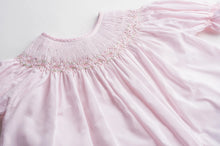 Load image into Gallery viewer, The Infant Girls Ruffle Sleeve Bishop Dress by Feltman Brothers is a delightful blend of elegance and charm. Its soft pink hue, classic smocking, and ruffle sleeves create an enchanting look, perfect for capturing precious moments. This heirloom-quality piece promises to be cherished for years to come!
