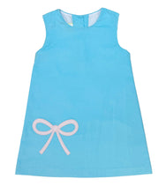 Load image into Gallery viewer, The Bow Hayden Jumper by Zuccini Kids wraps your little one in soft blue corduroy, beautifully accented with a delicate pink bow appliqué. Perfectly paired with a crisp white shirt, it brings timeless charm and comfort to every toddler’s day. White shirt not included. 
