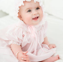 Load image into Gallery viewer, Experience the enchanting charm of the Rosette Bishop Dress by Feltman Brothers. This timeless pink dress, exudes elegance with its classic smocking and delicate ruffle sleeves. Perfect for creating cherished memories, it’s an heirloom piece that celebrates the beauty of childhood!
