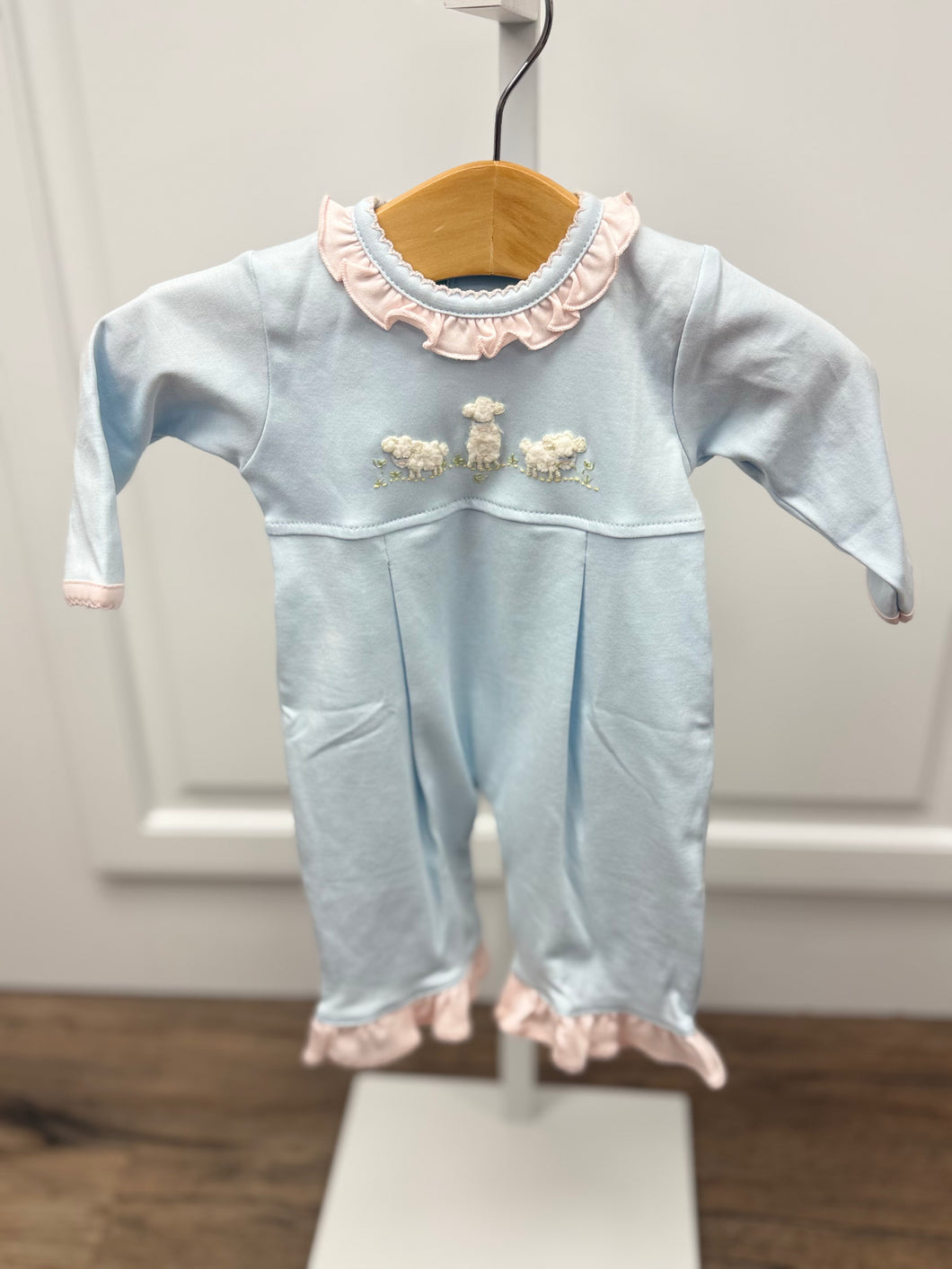 Infant Girl's 3 Lamb Long Bubble from Squiggles is the perfect blend of sweet style and everyday comfort. This light blue romper features charming lamb appliques that make it stand out from basic basics, while delicate pink ruffles frame the neckline and pant hem for an extra touch of elegance. 