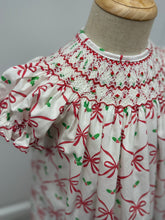 Load image into Gallery viewer, Celebrate the season in timeless elegance with this charming Girl&#39;s Alison Holiday Bows Bishop Dress from Anavini. Featuring a festive red bows design paired with mistletoe holly accents, this toddler dress captures holiday magic with sophisticated style. The signature smocked bishop neckline adds a classic, heirloom-quality touch that makes it perfect for special occasions, family photos, and holiday gatherings.&nbsp;

