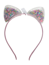 Load image into Gallery viewer, Add a whimsical touch to your little girl&#39;s accessories with Anuja Tolia&#39;s Embellished Ear Headbands! These playful headbands come in 3 colors and are sure to be a hit with your fashion-forward child.
