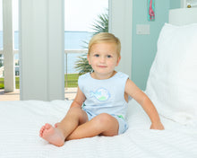 Load image into Gallery viewer, The Puffer Fish Appliqué Jon Jon by Cape Point Clothing Co. is a delightful light blue gingham outfit adorned with charming blue and green puffer fish appliqués. Its classic design makes it ideal for beach trips, while the option for a matching sibling infant girl bloomer set adds extra joy to family outings. Dress your little one in this enchanting piece that celebrates fun and adventure!
