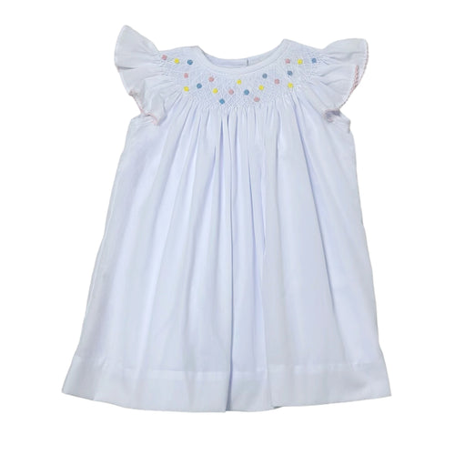 Introducing the Geo Flowers Bishop Dress from Zuccini Kids, a beautiful and versatile outfit for toddler girls. This set includes a white batiste bishop dress with a smocked collar and vibrant flower blooms. Perfect for any occasion, this set will keep your little one looking adorable and comfortable.