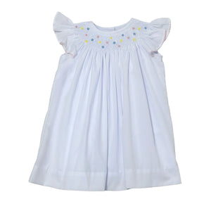 Introducing the Geo Flowers Bishop Dress from Zuccini Kids, a beautiful and versatile outfit for toddler girls. This set includes a white batiste bishop dress with a smocked collar and vibrant flower blooms. Perfect for any occasion, this set will keep your little one looking adorable and comfortable.